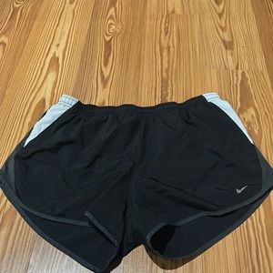 black nike shorts with grey and  white on the side